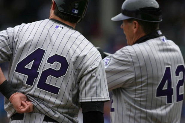 CHICAGO - APRIL 15: Ian Stewart (L) and third base coach Rich Dauer of the Colorado Rockies wear #42 jerseys in honor of Jackie Robinson Day during a game against the Chicago Cubs on April 15, 2009 at Wrigley Field in Chicago, Illinois. (Photo by Jonathan