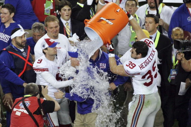 GLENDALE, AZ - FEBRUARY 03:  Madison Hedgecock #39 of the New York Giants dumps Gatorade on head coach Tom Coughlin after the Giants defeated the New England Patriots 17-14 during Super Bowl XLII on February 3, 2008 at the University of Phoenix Stadium in
