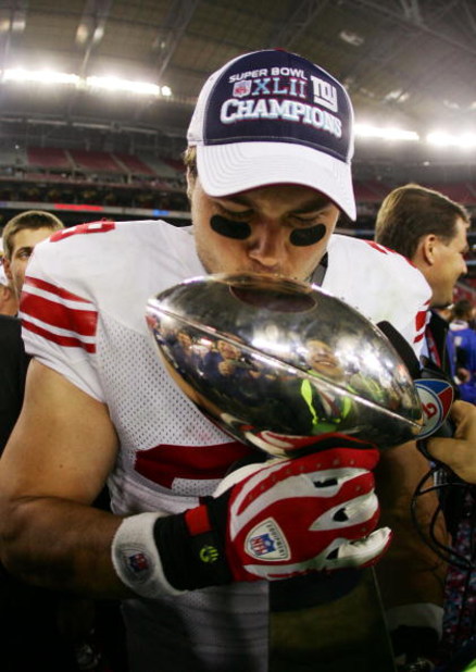 GLENDALE, AZ - FEBRUARY 03:  Madison Hedgecock #39 of the New York Giants kisses the Vince Lombardi Trophy after defeating the New England Patriots 17-14 in Super Bowl XLII on February 3, 2008 at the University of Phoenix Stadium in Glendale, Arizona.  (P