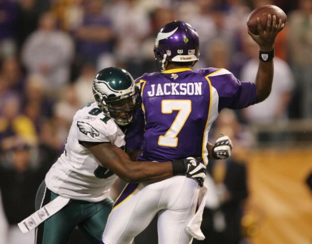 MINNEAPOLIS - JANUARY 04:   Tavaris Jackson #7 of the Minnesota Vikings is hit by Chris Clemons #91 of the Philadelphia Eagles during the NFC Wild Card playoff game on January 4, 2009 at the Hubert H. Humphrey Metrodome in Minneapolis, Minnesota. The Eagl