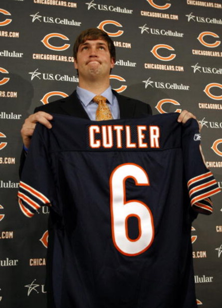 LAKE FOREST, IL - APRIL 3: Quarterback Jay Cutler of the Chicago Bears holds up his #6 jersey after he was introduced as their new quarterback during a press conference on April 3, 2009 at Halas Hall in Lake Forest, Illinois. (Photo by Jim Prisching/Getty