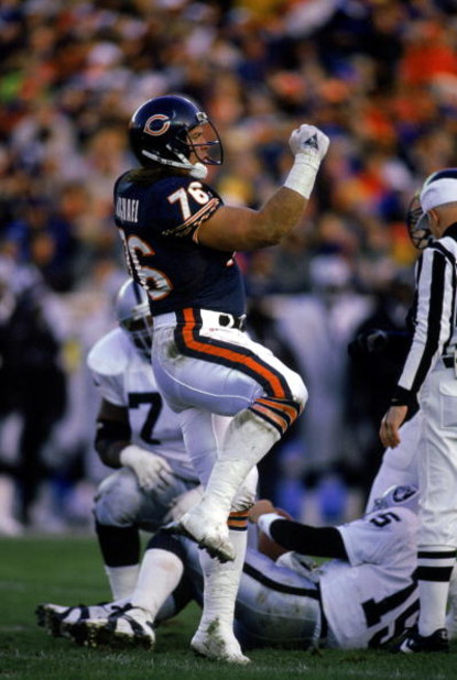 CHICAGO - NOVEMBER 7:  Steve McMichael #76 of the Chicago Bears celebrates during the game against the Los Angeles Raiders on November 7, 1993 in Chicago, Illinois. The Raiders won 16-14. (Photo by Jonathan Daniel/Getty Images)