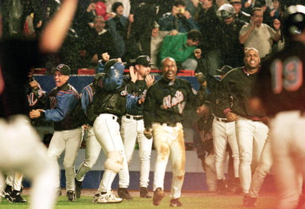 17 Oct 1999:  The New York Mets celebrate during the NLCS game four against the Atlanta Braves at Shea Stadium in Flushing, New York. The Mets defeated the Braves 4-3. Mandatory Credit: Jamie Squire  /Allsport