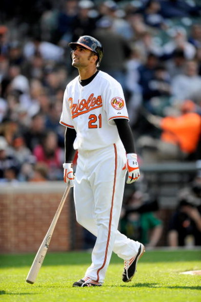 BALTIMORE - APRIL 09:  Nick Markakis #21 of the Baltimore Orioles walks to the dugout after striking out against the New York Yankees at Camden Yards on April 9, 2009 in Baltimore, Maryland.  (Photo by Greg Fiume/Getty Images)