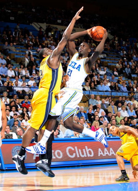 WESTWOOD, CA - JANUARY 29:  Jrue Holiday #21 of the UCLA Bruins scores on a layup against Theo Robertson #24 of the University of California Golden Bears during the second half at Pauley Pavilion on January 29, 2009 in Westwood, California. UCLA won, 81-6