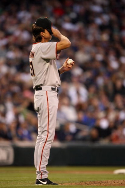 SEATTLE - MAY 22:  Randy Johnson #51 of the San Francisco Giants adjusts his cap during the game against the Seattle Mariners on May 22, 2009 in Seattle, Washington. The Mariners defeated the Giants 2-1 in twelve innings. (Photo by Otto Greule Jr/Getty Im