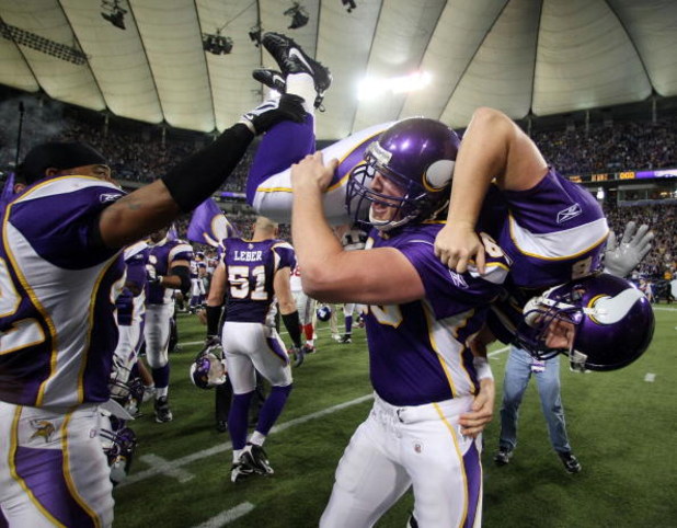 MINNEAPOLIS - DECEMBER 28:   Ryan Longwell #8 of the Minnesota Vikings is carried by Cullen Loeffler #46 after Longwell kicked the game winning field goal with five seconds left in the game against the New York Giants on December 28,2008 at the Hubert H. 