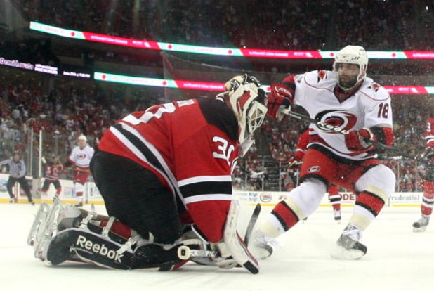 NEWARK, NJ - APRIL 28: Ryan Bayda #18 of the Carolina Hurricanes is stopped by Martin Brodeur #30 of the New Jersey Devils during Game Seven of the Eastern Conference Semifinal Round of the 2009 Stanley Cup Playoffs at the Prudential Center on April 28, 2