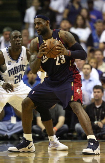 ORLANDO, FL - MAY 30:  LeBron James #23 of the Cleveland Cavaliers handles the ball against Mickael Pietrus #20 of the Orlando Magic in Game Six of the Eastern Conference Finals during the 2009 Playoffs at Amway Arena on May 30, 2009 in Orlando, Florida. 