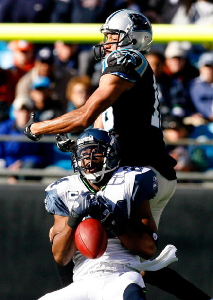 CHARLOTTE, NC - DECEMBER 16:  Strong safety Deon Grant #24 of the Seattle Seahawks nearly intercepts a pass intended for receiver Drew Carter #18 of the Carolina Panthers during the first half at Bank of America Stadium on December 16, 2007 in Charlotte, 