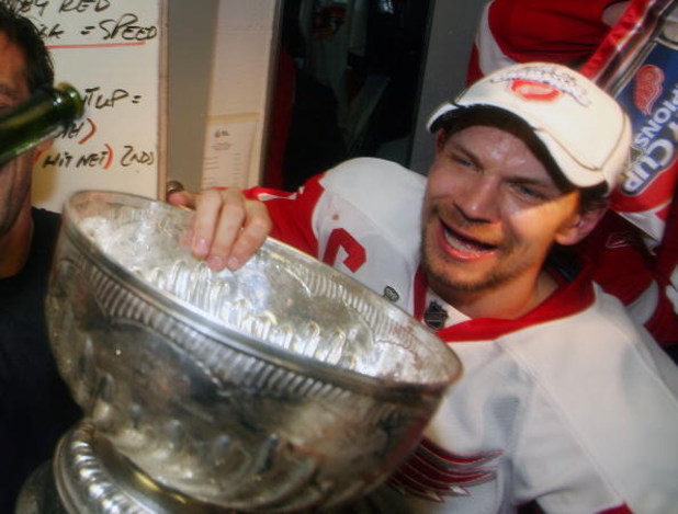 PITTSBURGH - JUNE 04: Nicklas Lidstrom #5 of the Detroit Red Wings celebrates with the Stanley Cup after defeating the Pittsburgh Penguins in game six of the 2008 NHL Stanley Cup Finals at Mellon Arena on June 4, 2008 in Pittsburgh. Pennsylvania. The Red 