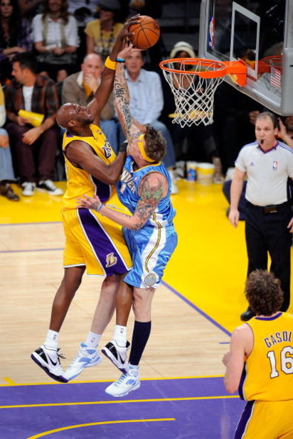 LOS ANGELES, CA - MAY 27:  Lamar Odom #7 of the Los Angeles Lakers is blocked by Chris Andersen #11 of the Denver Nuggets in the first quarter of Game Five of the Western Conference Finals during the 2009 NBA Playoffs at Staples Center on May 27, 2009 in 