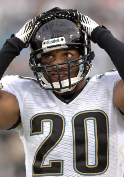 Jacksonville Jaguars safety Donovin Darius tightens his helmet as a shutout nears against the New York Jets on October 8, 2006 in Jacksonville, Florida. The Jaguars defeated the New York Jets 41 - 0.  (Photo by Al Messerschmidt/Getty Images)