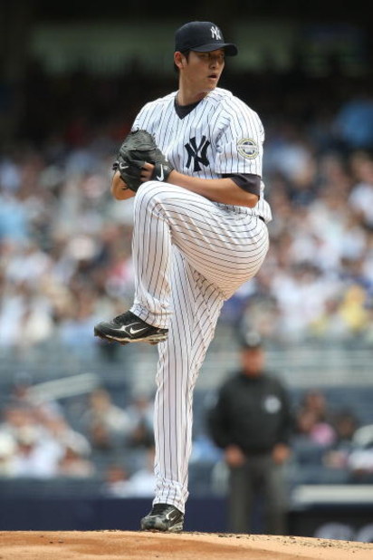 NEW YORK - APRIL 18:  Chien-Ming Wang #40  of the New York Yankees pitches against the Cleveland Indians at Yankee Stadium on April 18, 2009 in the Bronx borough of New York City.  (Photo by Nick Laham/Getty Images)