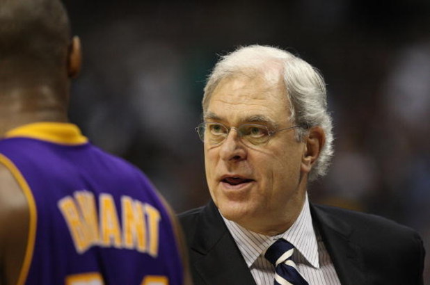 DENVER - MAY 25:  Head coach Phil Jackson of the Los Angeles Lakers coaches speaks with Kobe Bryant #24 against the Denver Nuggets in Game Four of the Western Conference Finals during the 2009 NBA Playoffs at Pepsi Center on May 25, 2009 in Denver, Colora