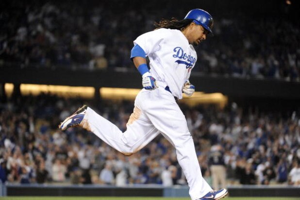 LOS ANGELES, CA - APRIL 30: Manny Ramirez #99 of the Los Angeles Dodgers hits a homerun for a 4-3 lead against the San Diego Padres during the third inning at Dodger Stadium on April 30, 2009 in Los Angeles, California. (Photo by Harry How/Getty Images)