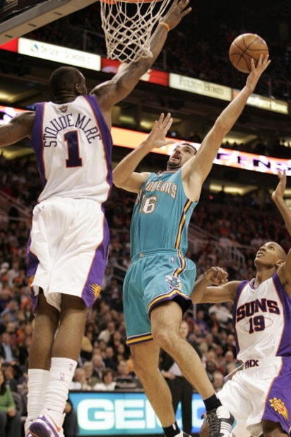 PHOENIX - FEBRUARY 6: Peja Stojakovic #16 of the New Orleans Hornets shoots over Amare' Stoudemire #1 of the Phoenix Suns on February 6, 2008 at US Airways Center in Phoenix, Arizona. NOTE TO USER: User expressly acknowledges and agrees that, by download