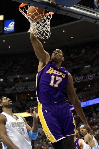 DENVER - MAY 29:  Andrew Bynum #17 of the Los Angeles Lakers dunks the ball in front of Nene #31 of the Denver Nuggets in Game Six of the Western Conference Finals during the 2009 NBA Playoffs at Pepsi Center on May 29, 2009 in Denver, Colorado. NOTE TO U