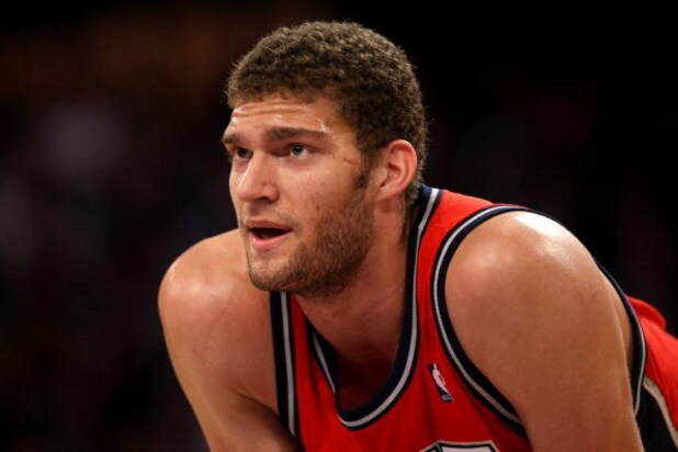 LOS ANGELES, CA - NOVEMBER 25: Brook Loopez #11 of the New Jersey Nets rests during a break in the game against the Los Angeles Lakers on November 25, 2008 at Staples Center in Los Angeles, California. The Lakers won 120-93. NOTE TO USER: User expressly