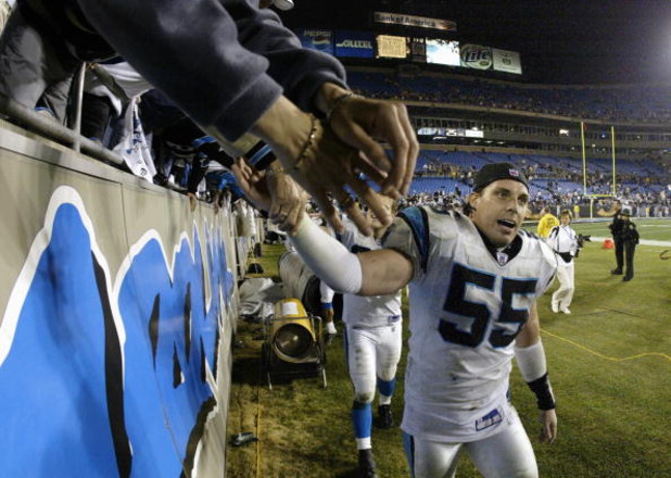 CHARLOTTE, NC - JANUARY 3:  Linebacker Dan Morgan #55 of the Carolina Panthers celebrates after winning the NFC Wildcard game against the Dallas Cowboys at Ericsson Stadium on January 3, 2004 in Charlotte, North Carolina.  The Panthers defeated the Cowboy