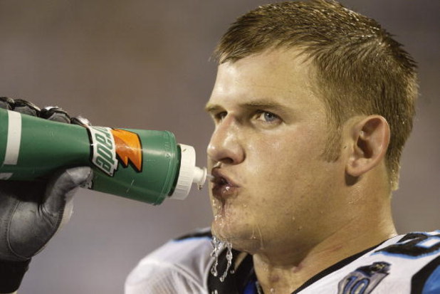 CHARLOTTE, NC - AUGUST 28:  Tackle Jordan Gross #69 of the Carolina Panthers drinks during the preseason game against the New England Patriots at Bank of America Stadium on August 28, 2004 in Charlotte, North Carolina. The Panthers won 20-17. (Photo By Cr
