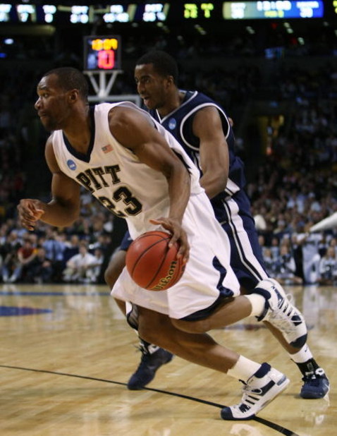 BOSTON - MARCH 26:  Sam Young #23 of the Pittsburgh Panthers drives past Jamel McLean #22 of the Xavier Musketeers during the NCAA Men's Basketball Tournament East Regionals at TD Banknorth Garden on March 26, 2009 in Boston, Massachusetts.  (Photo by Els