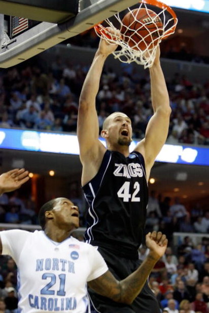 MEMPHIS, TN - MARCH 27:  Josh Heytvelt #42 of the Gonzaga Bulldogs dunks the ball over Deon Thompson #21 of the North Carolina Tar Heels in the first half during the NCAA Men's Basketball Tournament South Regionals at the FedExForum on March 27, 2009 in M