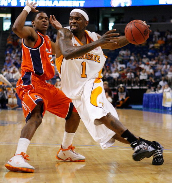 TAMPA, FL - MARCH 14:  Tyler Smith #1 of the Tennessee Volunteers drives the ball around Frankie Sullivan #20 of the Auburn Tigers during the Semifinal round of the SEC Men's Basketball Tournament on March 14, 2009 at The St. Pete Times Forum in Tampa, Fl