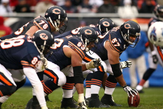 CHICAGO - NOVEMBER 09:  Olin Kreutz #57 of the Chicago Bears centers the ball at the line of scrimmage against the Tennessee Titans at Soldier Field on November 9, 2008 in Chicago, Illinois. The Titans won 21-14. (Photo by Jonathan Ferrey/Getty Images)