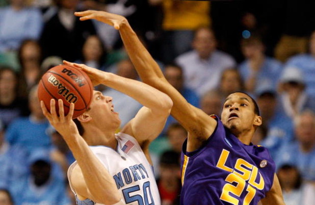 GREENSBORO, NC - MARCH 21:  Chris Johnson #21 of the Louisiana State University Tigers defends against Tyler Hansbrough #50 of the North Carolina Tar Heels during the second round of the NCAA Division I Men's Basketball Tournament at the Greensboro Colise