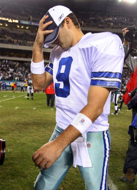 PHILADELPHIA - DECEMBER 28:  Tony Romo #9 of the Dallas Cowboys walks off the field after playing the Philadelphia Eagles on December 28, 2008 at Lincoln Financial Field in Philadelphia, Pennsylvania. The Eagles defeated the Cowboys 44-6.  (Photo by Jim M