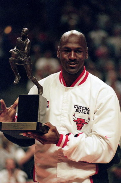 12 Jun 1998:  Michael Jordan #23 of the Chicago Bulls holds up the MVP trophy before the Eastern Conference game against the Indiana Pacers at the United Center in Chicago, Illinois. The Bulls defeated the Pacers 104-98. .  Mandatory Credit: Jonathan Dani