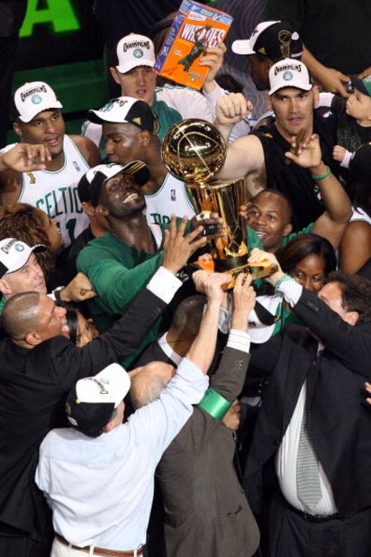 BOSTON - JUNE 17:  Kevin Garnett #5 of the Boston Celtics celebrates with the Larry O'Brien trophy after defeating the Los Angeles Lakers in Game Six of the 2008 NBA Finals on June 17, 2008 at TD Banknorth Garden in Boston, Massachusetts. NOTE TO USER: Us