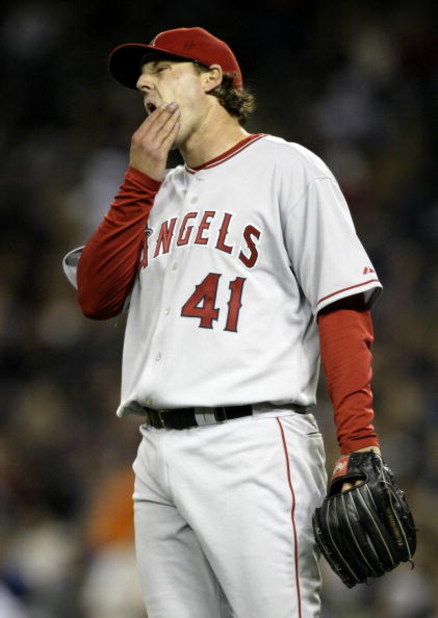SEATTLE - APRIL 4:  Starting Pitcher John Lackey #41 of the Los Angeles Angels of Anaheim reacts after giving up a single in the fourth inning to Ichiro Suzuki of the Seattle Mariners on April 4, 2006 at Safeco Field in Seattle, Washington.  (Photo by Ott
