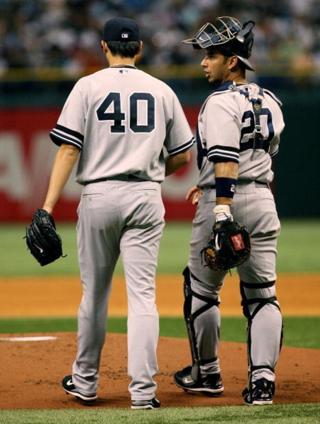 TAMPA, FL - JULY 14:  Starting pitcher Chien-Ming Wang #40 of the New York Yankees talks with catcher Jorge Posada #20 after Wang gave up three runs in the first inning against the Tampa Bay Devil Rays at Tropicana Field on July 14, 2007 in St. Petersburg