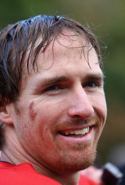 CHANDLER'S CROSS, UNITED KINGDOM - OCTOBER 22: Drew Brees of New Orleans Saints talks to the media after a training session at The Grove Hotel on October 22, 2008 in Chandler's Cross, England.The NFL match between New Orleans Saints and San Diego Charger