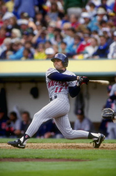 3 Aug 1991:  Chuck Knoblauch #11 of the Minnesota Twins hits a pitch during a game against the Oakland Athletics at the Oakland Coliseum in Oakland, California. Mandatory Credit: Otto Greule Jr.  /Allsport
