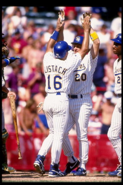 26 Aug 1993:  Third baseman Kevin Seitzer of the Milwaukee Brewers (center) greets teammate Pat Listach (left) during a game against the Oakland Athletics at Milwaukee County Stadium in Milwaukee, Wisconsin. Mandatory Credit: Jonathan Daniel  /Allsport