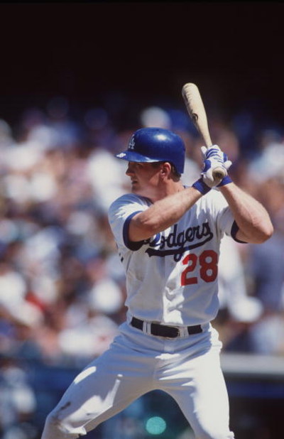 24 Aug 1996:  Outfielder Todd Hollandsworth of the Los Angeles Dodgers stares back at the mound as he awaits the release of a pitch during an at-bat in the Dodgers 7-5 victory over the New York Mets at Dodger Stadium in Los Angeles, California.