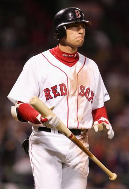 BOSTON - OCTOBER 14: Jed Lowrie #12 of the Boston Red Sox waits on deck in the ninth inning of game four of the American League Championship Series against the Tampa Bay Rays during the 2008 MLB playoffs at Fenway Park on October 14, 2008 in Boston, Mass