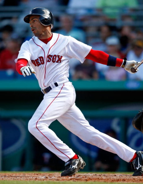 FT. MYERS, FL - MARCH 2: Shortstop Julio Lugo #23 of the Boston Red Sox gets a hit against the Minnesota Twins during the game on March 2, 2008 at City of Palms Park in Ft. Myers, Florida. (Photo by J. Meric/Getty Images)