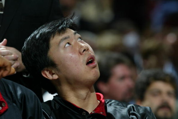 SACRAMENTO, CA -  JANUARY 13:  Wang Zhizhi #15 of the Miami Heat watches the game against the Sacramento Kings during the game on January 13, 2004 at Arco Arena in Sacramento, California.  The Kings won 90-86.   NOTE TO USER: User expressly acknowledges a