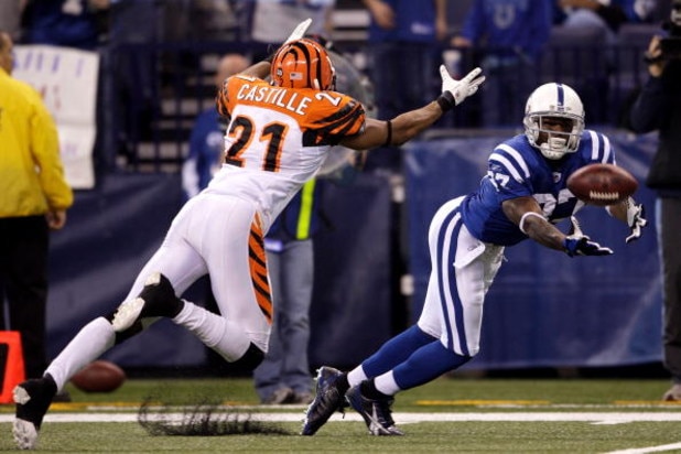INDIANAPOLIS - DECEMBER 07: Reggie Wayne #87 of the Indianapolis Colts can't make a play on a ball thrown to him against Simeon Castille #21 of the Cincinnati Bengals at Lucas Oil Stadium on December 7, 2008 in Indianapolis, Indiana. (Photo by Andy Lyon
