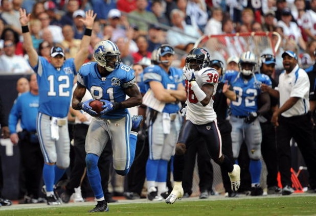 HOUSTON - OCTOBER 19: Wide receiver Calvin Johnson #81 of the Detroit Lions makes a touchdown pass reception against DeMarcus Faggins #38 of the Houston Texans at Reliant Stadium on October 19, 2008 in Houston, Texas. (Photo by Ronald Martinez/Getty Ima