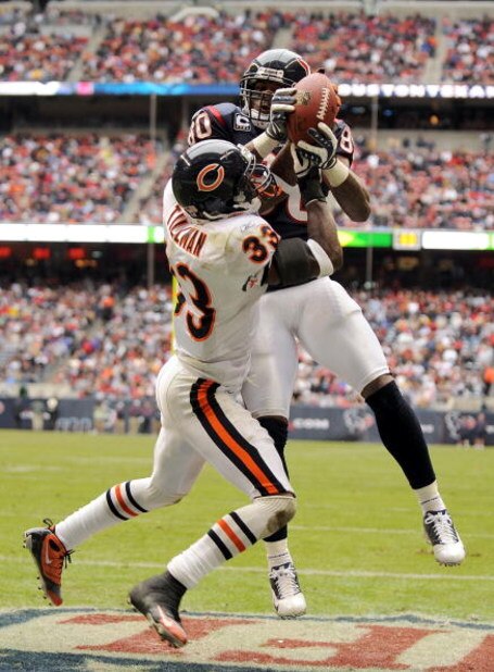 HOUSTON - DECEMBER 28: Andre Johnson #80 of the Houston Texans makes a catch for a touchdown over Charles Tillman #33 of the Chicago Bears for a 14-10 lead during the first half at the Reliant Stadium December 28, 2008 in Houston, Texas. (Photo by Harry