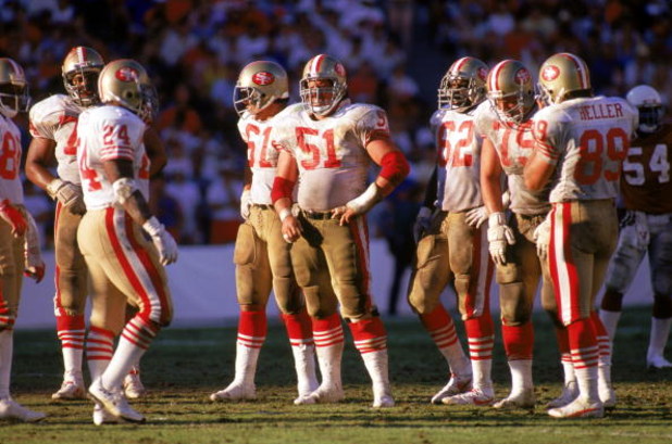 TEMPE, AZ - NOVEMBER 6: Center Randy Cross #51 of the San Francisco 49ers waits with his teammates for play to resume during a game against the Phoenix Cardinals at Sun Devil Stadium on November 6, 1988 in Tempe, Arizona.  The Cardinals won 24-23.  (Photo