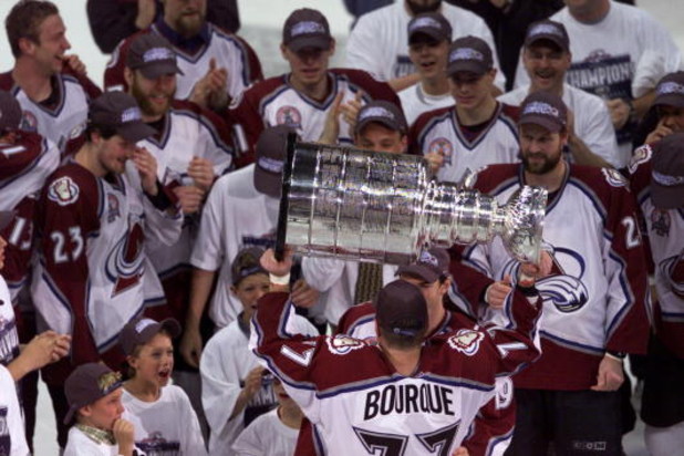 9 Jun 2001: Ray Bourque #77 of the Colorado Avalanche hoists the Stanley Cup after defeating the New Jersey Devils during the Stanley Cup finals at the Pepsi Center in Denver, Colorado. The Avalanche defeated the Devils 3-1 to win the series 4-3. DIGITAL 