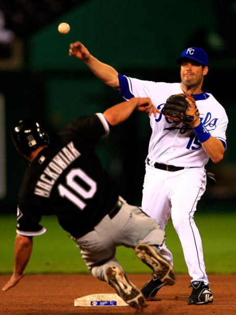 KANSAS CITY, MO - APRIL 24:  Mark Grudzielanek #15 of the Kansas City Royals turns a double play as Rob Mackowiak #10 of the Chicago White Sox slides into second base during the 8th inning of the game on April 24, 2007 at Kauffman Stadium in Kansas City, 