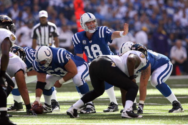 INDIANAPOLIS - OCTOBER 12:  Quarterback Peyton Manning #18 of the Indianapolis Colts signals a play call to his receiver during the NFL game against the Baltimore Ravens at Lucas Oil Stadium on October 12, 2008 in Indianapolis, Indiana. The Colts defeated
