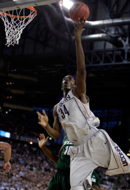 DETROIT - APRIL 04:  Hasheem Thabeet #34 of the Connecticut Huskies goes up for a shot in front of Delvon Roe #10 of the Michigan State Spartans during the National Semifinal game of the NCAA Division I Men's Basketball Championship at Ford Field on April